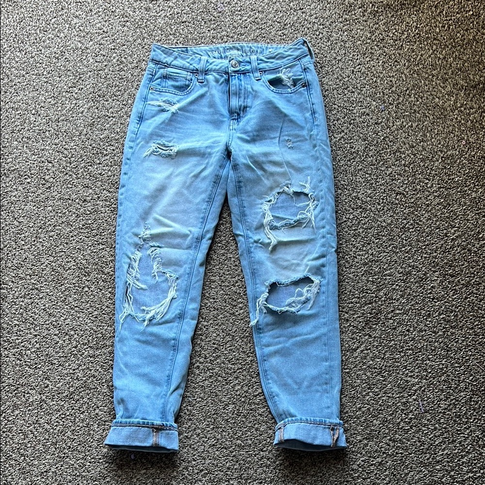 American Eagle “Hi Rise Tom Girl” distressed jeans